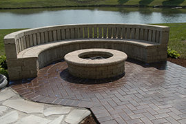 Circular patio with seating and gas firepit.