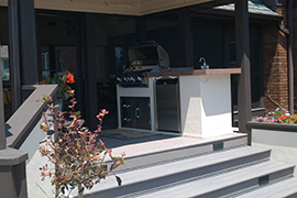 A whole outdoor kitchen in a small space.