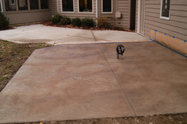 Stamped concrete patio with integrated fountain plumbing.