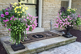Potted flower arrangements at entrance.