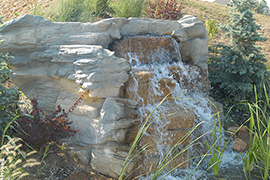 Waterfall enhances entrance to residential neighborhood